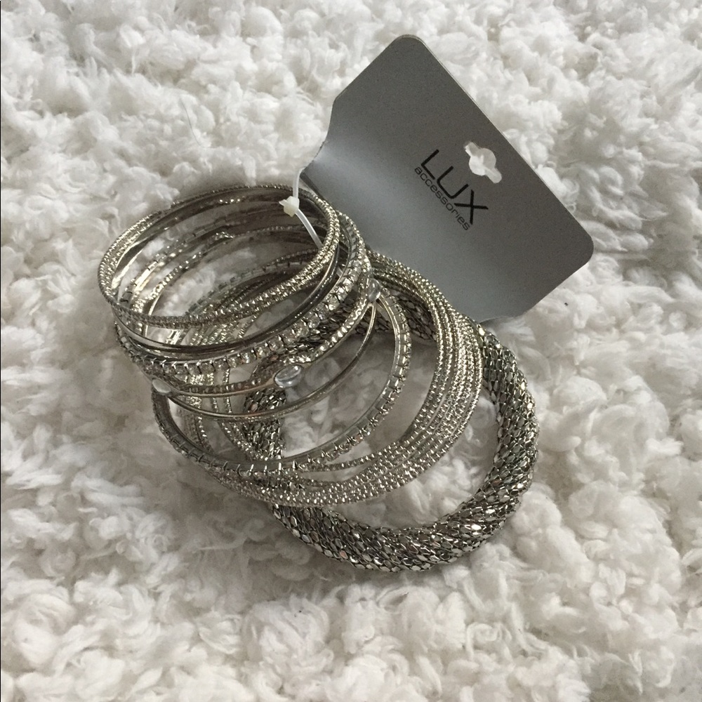 New package of lux silver/ rhinestone bracelet set